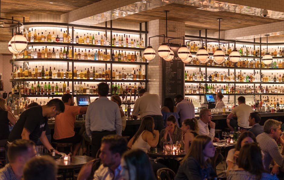 pexels-photo-1058277-1058277-1 Experience the lively atmosphere of a bustling New York City bar with patrons enjoying nightlife within a stylish indoor setting.